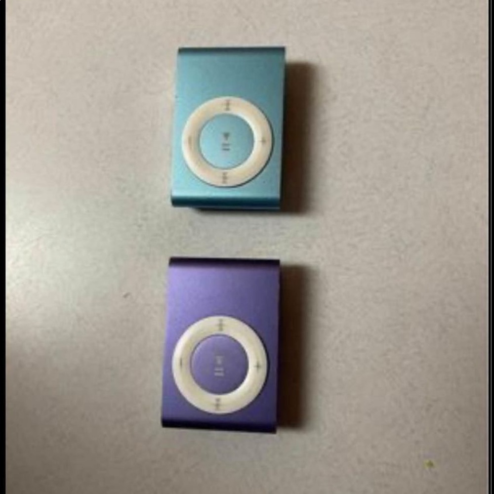 Two  3rd generation iPod shuffle’s and one charger